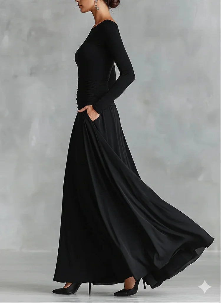 Modern long black crepe dress with pleated boat neckline