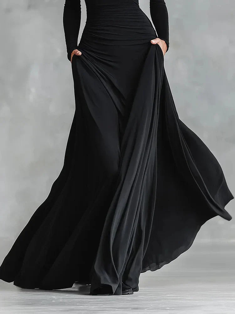 Modern long black crepe dress with pleated boat neckline