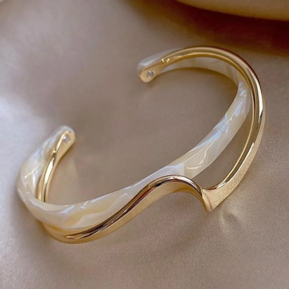 Golden bracelet with white opal