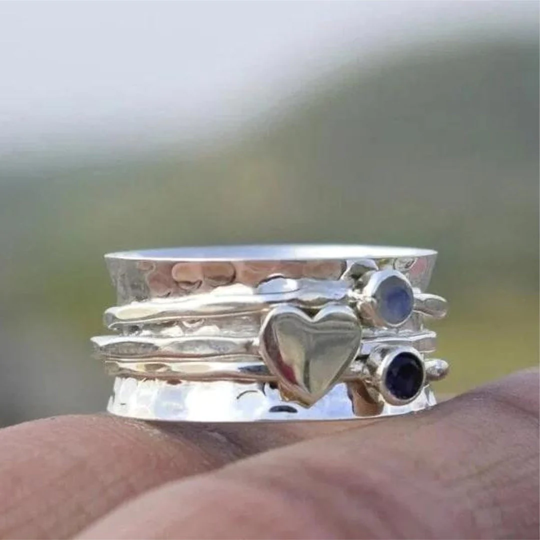 Elegant Rotating Heart-Shaped Sterling Silver Ring