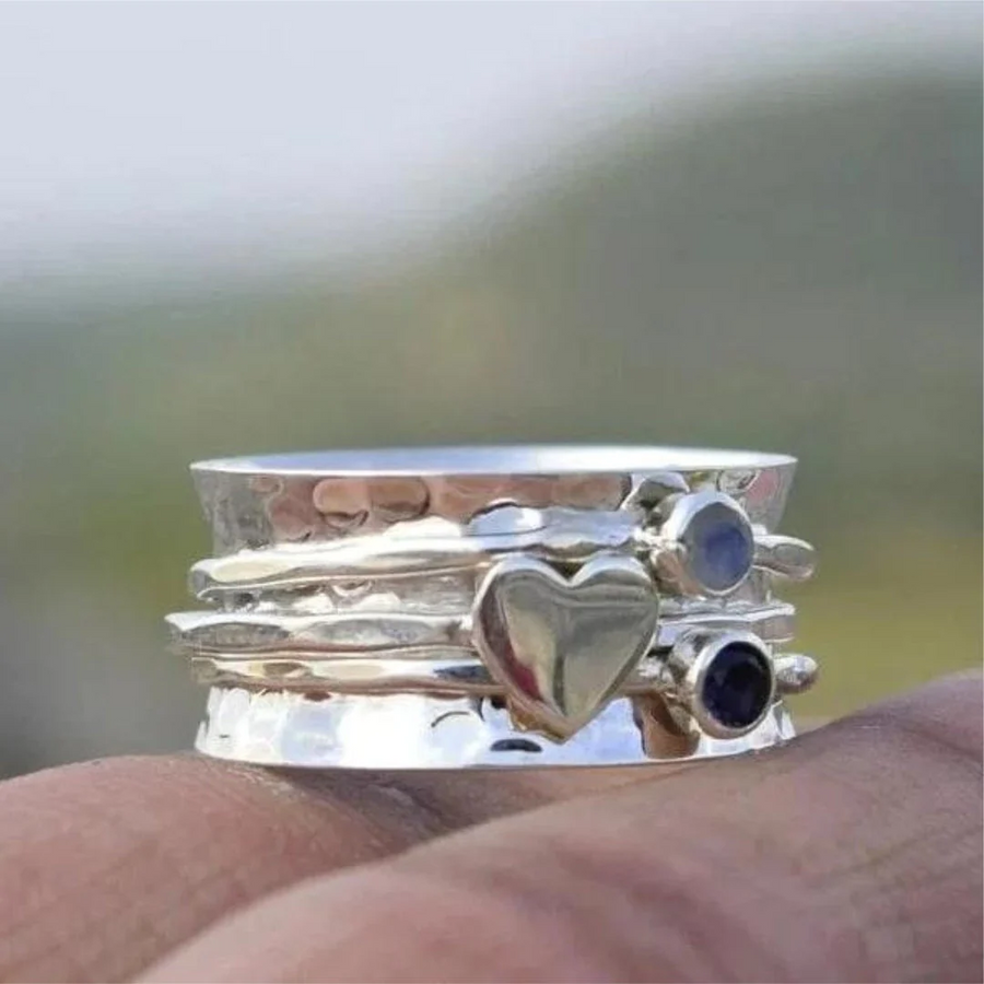 Elegant Rotating Heart-Shaped Sterling Silver Ring