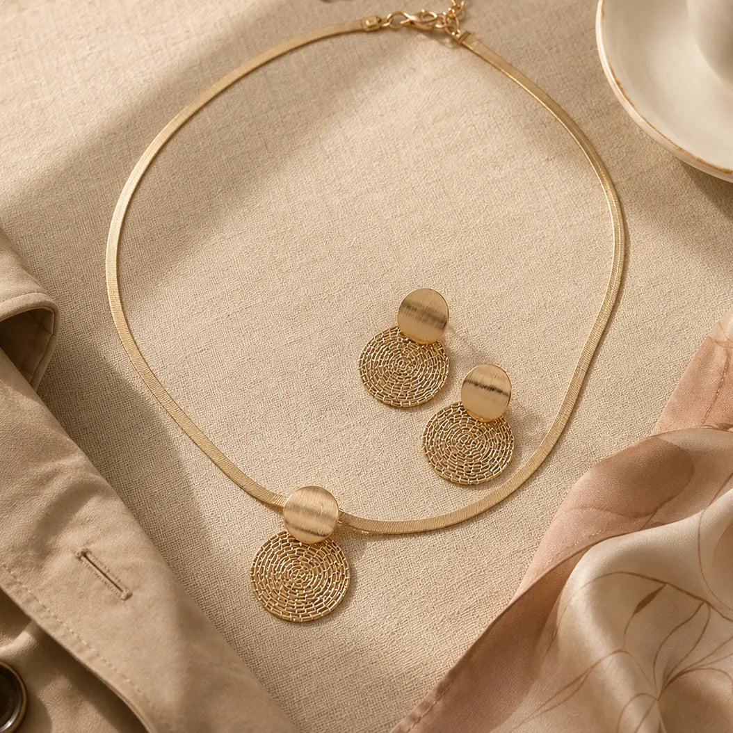 Aurenza – Gold necklace and earring set, textured medallion, flat snake chain